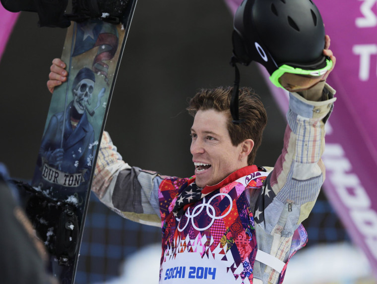 Shaun White of the United States waves to the crowd after a run during the men's snowboard halfpipe qualifying at the Rosa Khutor Extreme Park, at the 2014 Winter Olympics, Tuesday, Feb. 11, 2014, in Krasnaya Polyana, Russia. (AP Photo/Andy Wong)
