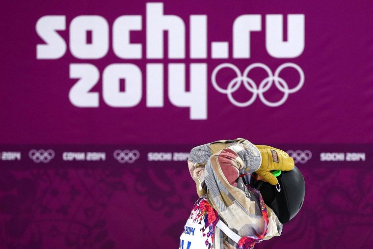 Taylor Gold of the United States reacts after his run during the Snowboard Men's Halfpipe Semifinal on day four of the Sochi 2014 Winter Olympics.