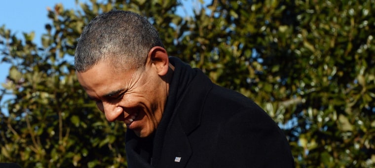 Image: US President Barack Obama smiles as French President Francois Hollande speak