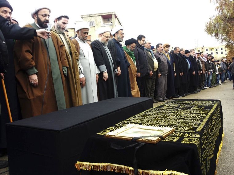 Image: Shiite Muslim sheiks and relatives of victims killed in a car bomb attack attend a funeral in Hermel, Lebanon, on Feb. 3