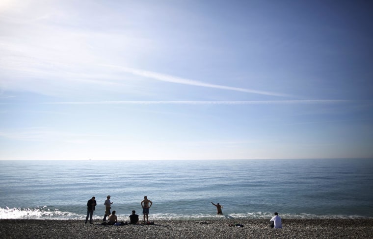 Local residents enjoy bathing along the Black Sea near the Olympic Park in Sochi.