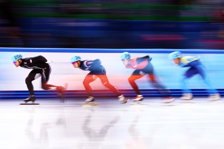 Eduardo Alvarez of the United States (L) leads the pack as he competes in the Short Track Speed Skating Men's 5000m Relay Semifinal on day 6 of the Sochi 2014 Winter Olympics at at Iceberg Skating Palace.