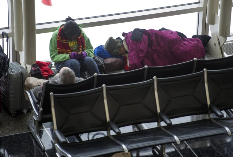 Stranded passengers pass the time on the worst travel day of the winter.