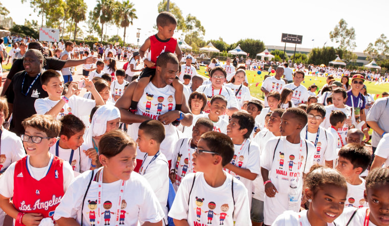 Image: Chris, with Lil Chris on his shoulders, at the 2013 LA's Best Walk attended by over 3,000 children in attendance.