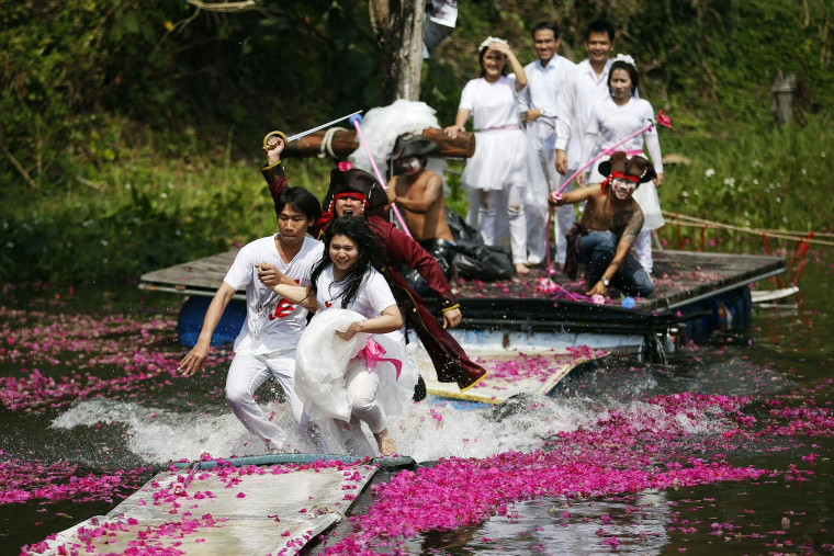  Pirates chase a bride and groom during during a wedding ceremony in Thailand.