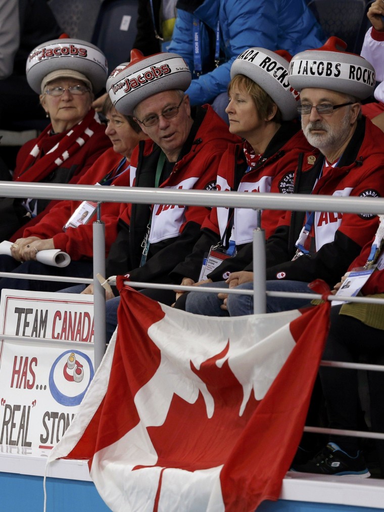 Image: Fans of Canada attend their men's curling round robin game against Norway at the 2014 Sochi Winter Olympics