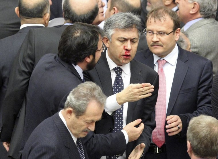 Image: Member of parliament from Republican People's Party Ali Ihsan Kokturk's nose bleeds in Ankara