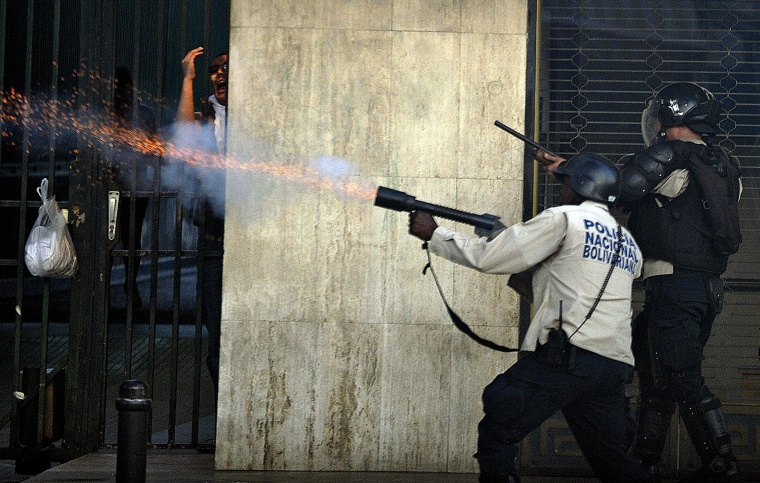 Image: Riot policemen shoot at anti-government students