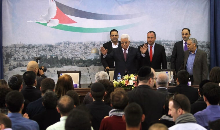 Image: Palestinian President Mahmoud Abbas waves to welcome Israeli University students