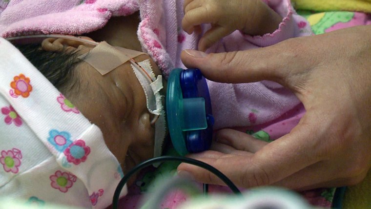 When a premature baby sucks on the pacifier-activated music player, the baby’s mother is heard singing a lullaby. 