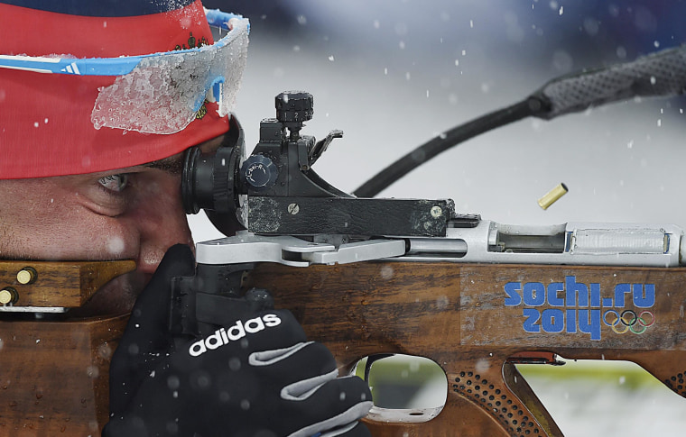 Evgeniy Garanichev of Russia takes a shot during the Men's 15km Mass Start competition during the Sochi 2014 Olympic Games in Krasnaya Polyana, Russia on Feb. 18.