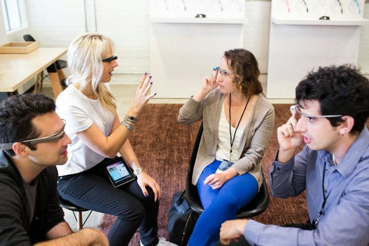 Google employees train users in Glass basics at a "Basecamp" event in Los Angeles in 2013.