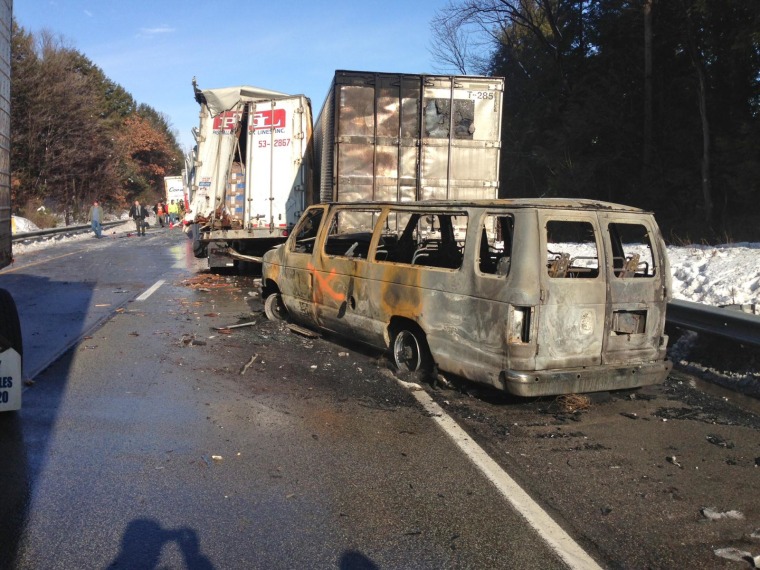 Damaged vehicles line the road after an accident on Interstate 80 in Clearfield Borough, Pa., on Feb. 19, 2014.