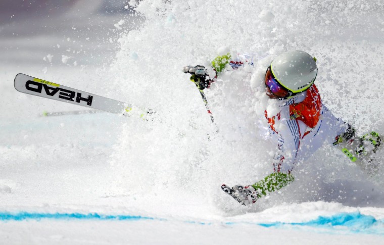 Image: Andorra's Verdu Sanchez crashes during the first run of the men's alpine skiing giant slalom event at the 2014 Sochi Winter Olympics