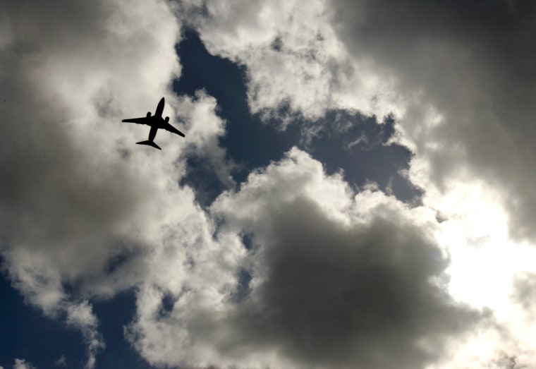 A Boeing 737 flies near clouds after departing San Diego International Airport Lindbergh Field.
