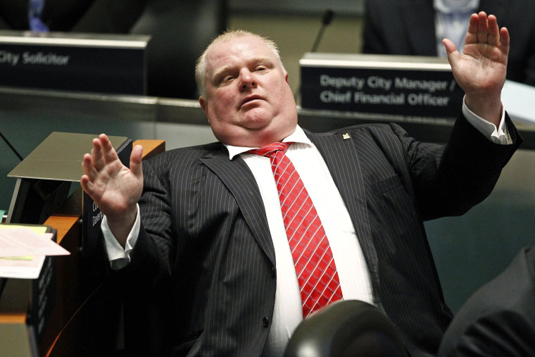 Image: Toronto Mayor Rob Ford reacts during a special council meeting at City Hall in Toronto