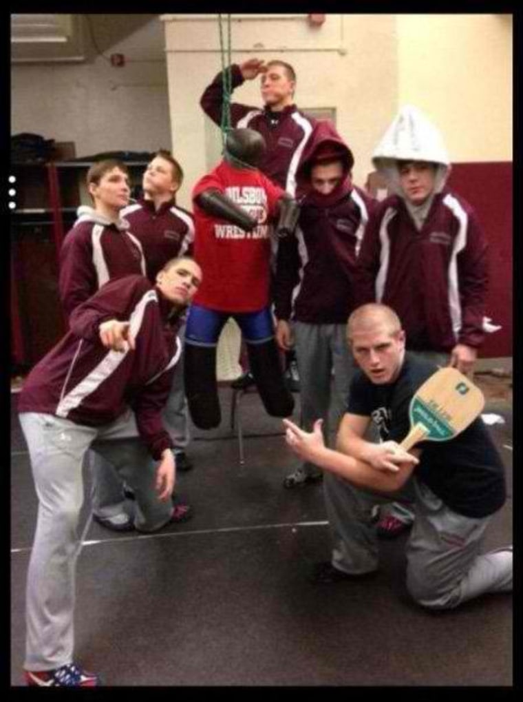 A photo that appears to show seven Phillipsburg High School boys with a wrestling dummy hanging by its neck