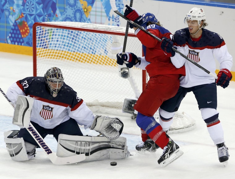Image: Team USA's goalie Quick makes a save as Czech Republic's Voracek and Team USA's Carlson battle in front of net during the third period of their men's quarter-finals ice hockey game at the 2014 Sochi Winter Olympic Games