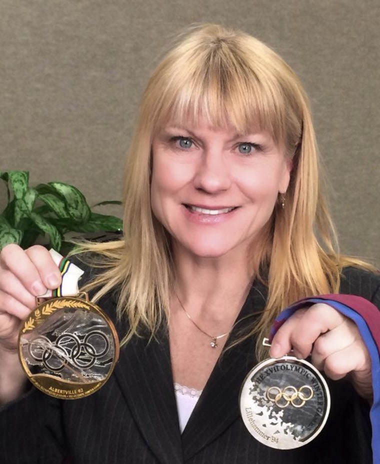 Former Olympian Cathy Turner poses with the medals she won in 1992 in Albertville and in 1994 in Lillehammer.