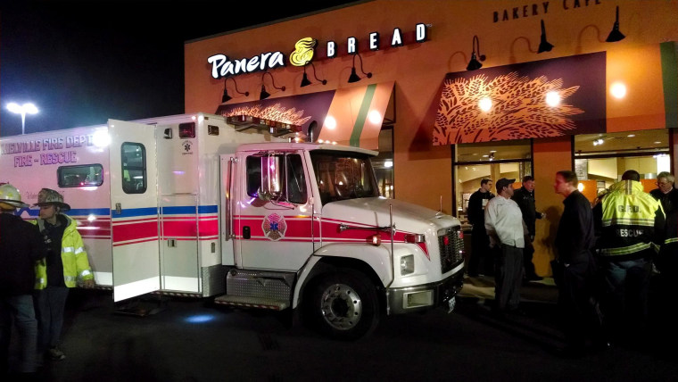 First responders stand outside Panera Bread's store at the Walt Whitman Mall in Huntington Long Island, New York late Saturday Feb. 22, 2014.