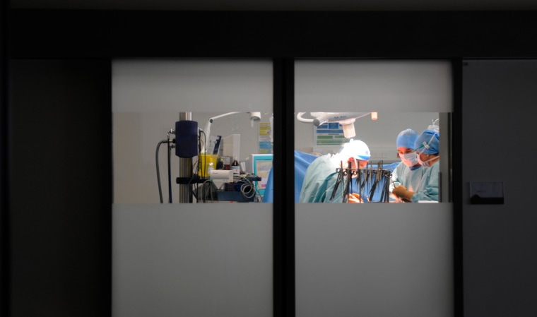 Doctors perform a hystero-ovariectomy at the department of urology, operating room, Lyon Sud, France.