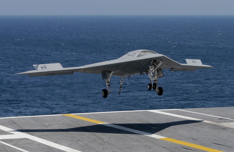 Image: A Navy drone lands on an aircraft carrier