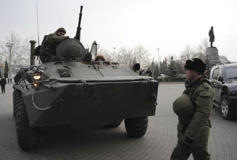 Image: A Russian armored personnel carrier is driven on a street in Sevastopol