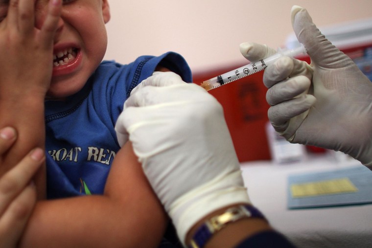 A 5-year-old boy receives an immunization shot from a school nurse in Florida. A new study finds public health messages aimed at increasing certain vaccination rates may have the opposite effect. 
