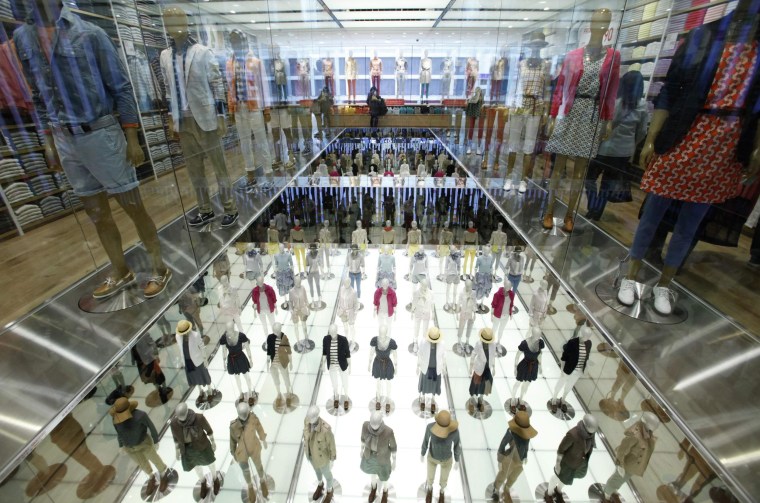 Mannequins are displayed at Fast Retailing's flagship Uniqlo store in Tokyo