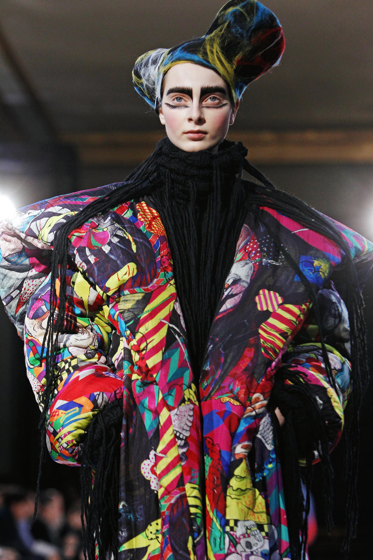Image: A model wears a creation for Yamamoto's ready-to-wear Fall/Winter 2014-2015 fashion collection