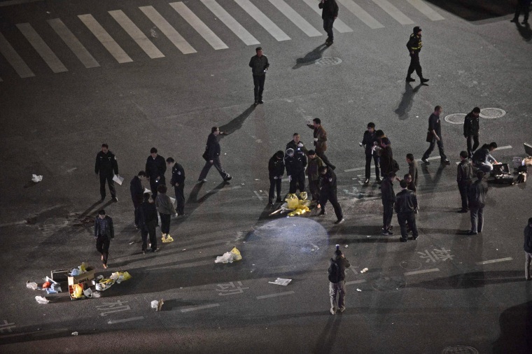 Image: Police investigate after a group of armed men attacked people at Kunming railway station, Yunnan province