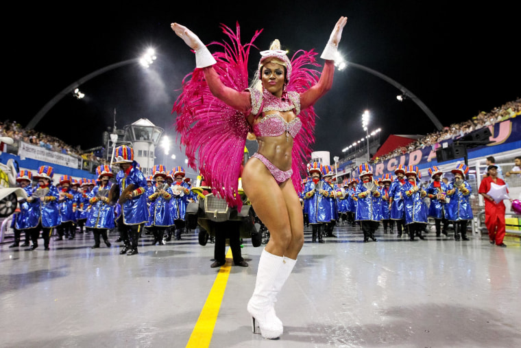 Image: Members of the Dragoes da Real samba school perform during the first night of the Sao Paulo's Carnival parade