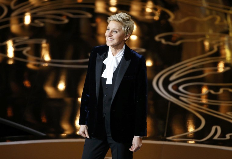 Image: Ellen Degeneres takes the stage to host the show at the start of the 86th Academy Awards in Hollywood