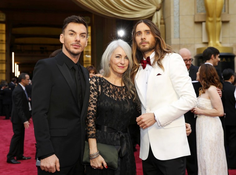 Image: Jared Leto, and his mother Constance Leto and brother Shannon Leto arrive on the red carpet at the 86th Academy Awards in Hollywood