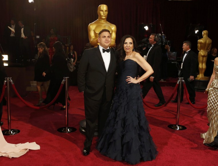 Image: Best supporting actor nomineee Jonah Hill of the film "The Wolf of Wall Street" arrives with his mother Sharon Lyn Chalkin at the 86th Academy Awards in Hollywood
