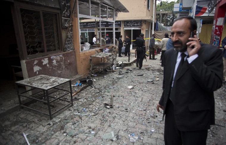 Image: A lawyer at the site of a suicide attack in a court complex in Islamabad on March 3, 2014.