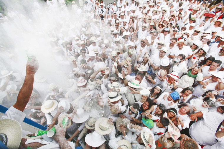 Image: People throw talcum powder