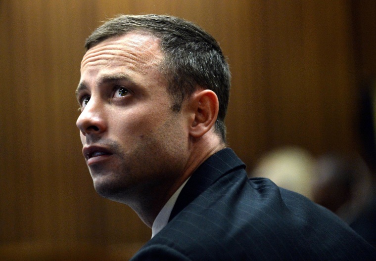 Oscar Pistorius in court on the second day of his trial at the North Gauteng High Court in Pretoria, South Africa, on March 4, 2014. Lawyers for Paralympian Oscar Pistorius will on March 4 resume a searing cross-examination of a key witness at his murder trial who claims to have heard screams, then shots, as his girlfriend was killed. The second day of Pistorius's trial for the Valentine's Day killing of Reeva Steenkamp will begin with lawyer Barry Roux redoubling efforts to pick apart the prosecution's premier witness. 