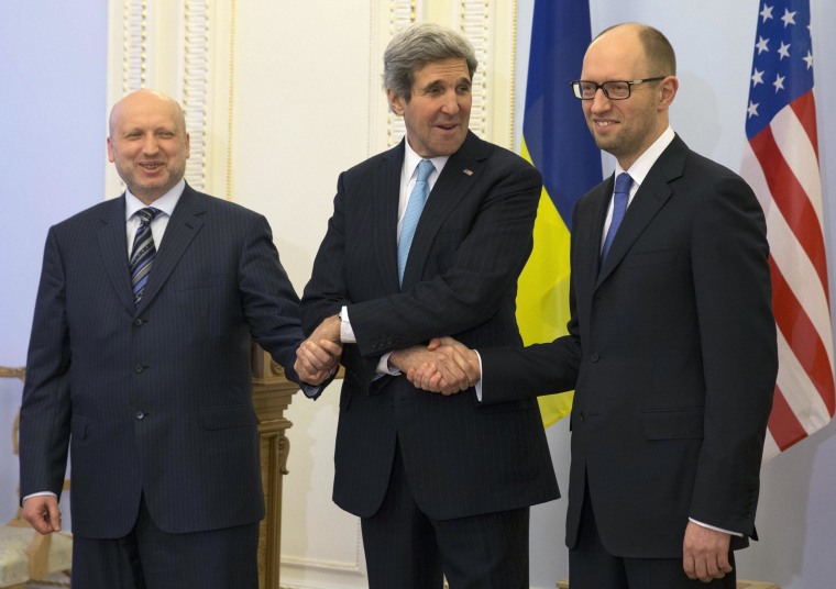 Image: Oleksandr Turchynov, John Kerry and Arseniy Yatsenyuk shake hands Tuesday.