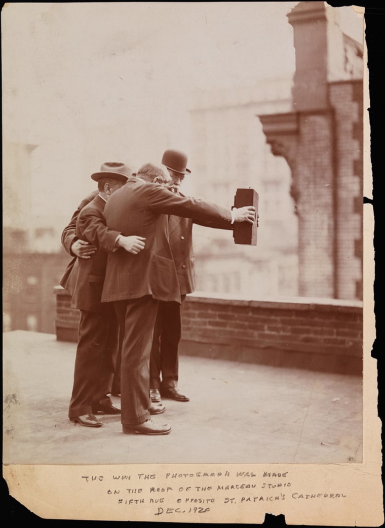Image: Five photographers pose together for a selfie in 1920.