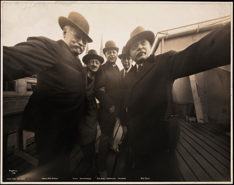 Image: Five photographers pose together for a selfie in 1920.