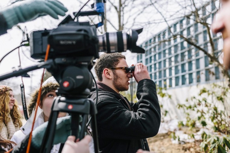 Image: High School student and director Max Novick frames a shot while shooting a scene in his upcoming film