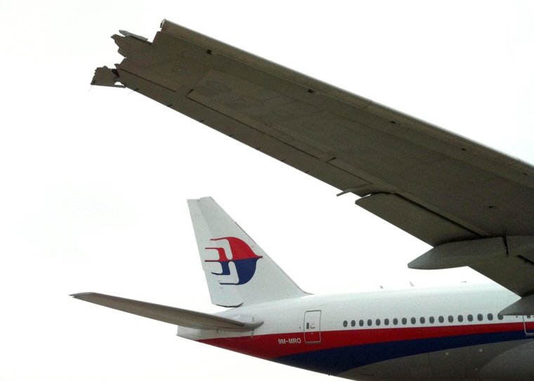 Image: The broken wing of a Malaysian Airline Boeing 777-200 passenger jet a day after it collided with a China Eastern Airline A340 plane