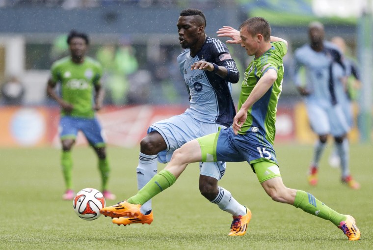 Image: Seattle Sounders' Dylan Remick, right, battles for the ball with Sporting Kansas City's C.J. Sapong, second from right, in the first half of an MLS soccer match, on March 8, 2014, in Seattle.