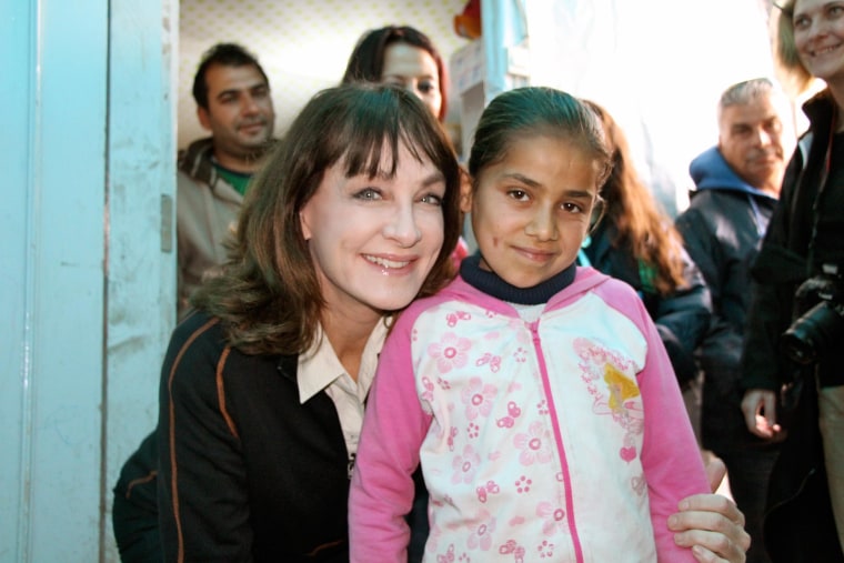 Dr. Nancy Snyderman with a child in a Syrian refugee camp in Lebanon.