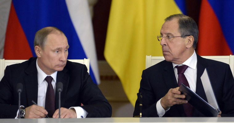Image: Russia's President Vladimir Putin with Foreign Minister Sergey Lavrov