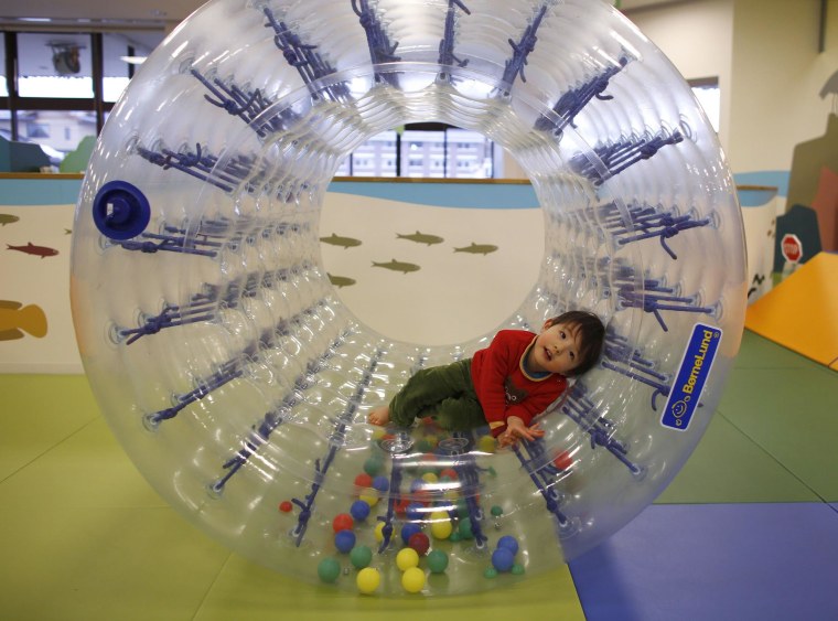 Image: Two-year-old Sakuya Zui plays at an indoor playground which was built for children and parents who refrain from playing outside because of concerns about nuclear radiation in Koriyama, west of the tsunami-crippled Fukushima Daiichi nuclear power pl