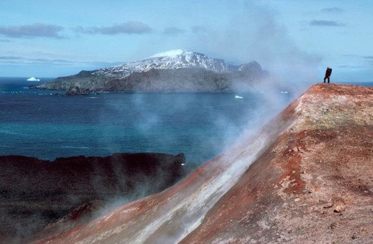 A man stands in a cloud of volcanic steam in the Antarctic South Sandwich Islands.