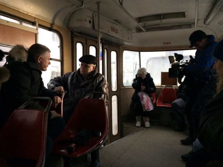 Ian Williams talks to Ukrainians on the tram in Kharkiv, Ukraine.