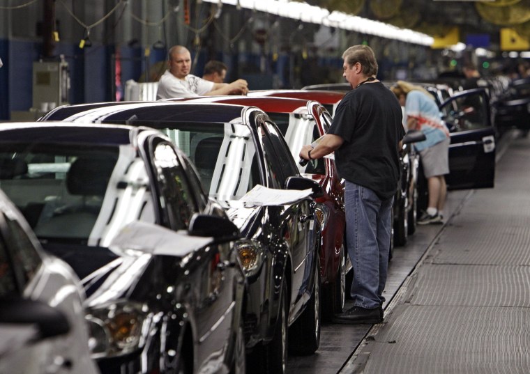 In this Tuesday, June 15, 2010, photo, workers at General Motors' Lordstown Assembly plant in Lordstown, Ohio put the final touches on Chevy Cobalts.